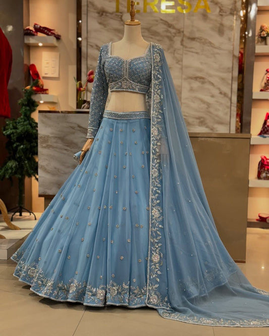 Astonishing Wedding Wear Blue Color Thread And Sequence Work Faux Georgette Lehenga Choli